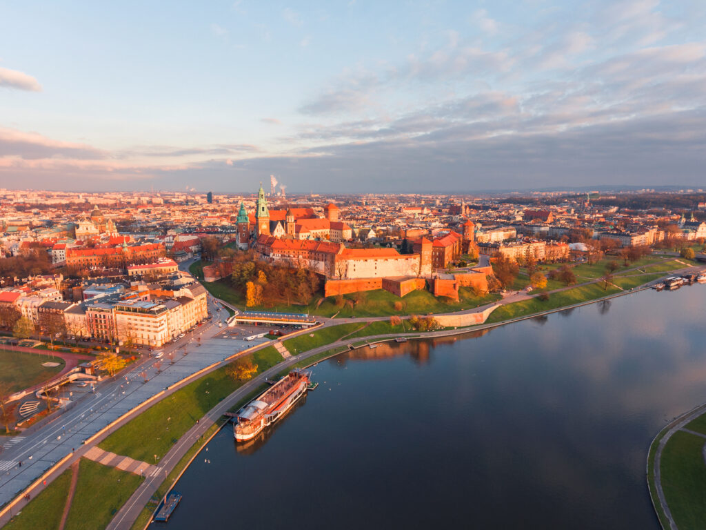 Drone aerial view at gold sunset time of royal Castle in Cracow